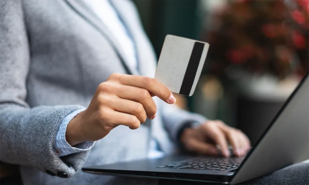 a person holding a bank card